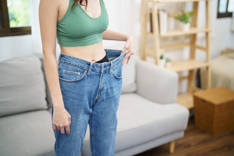 Slim woman oversized jeans
