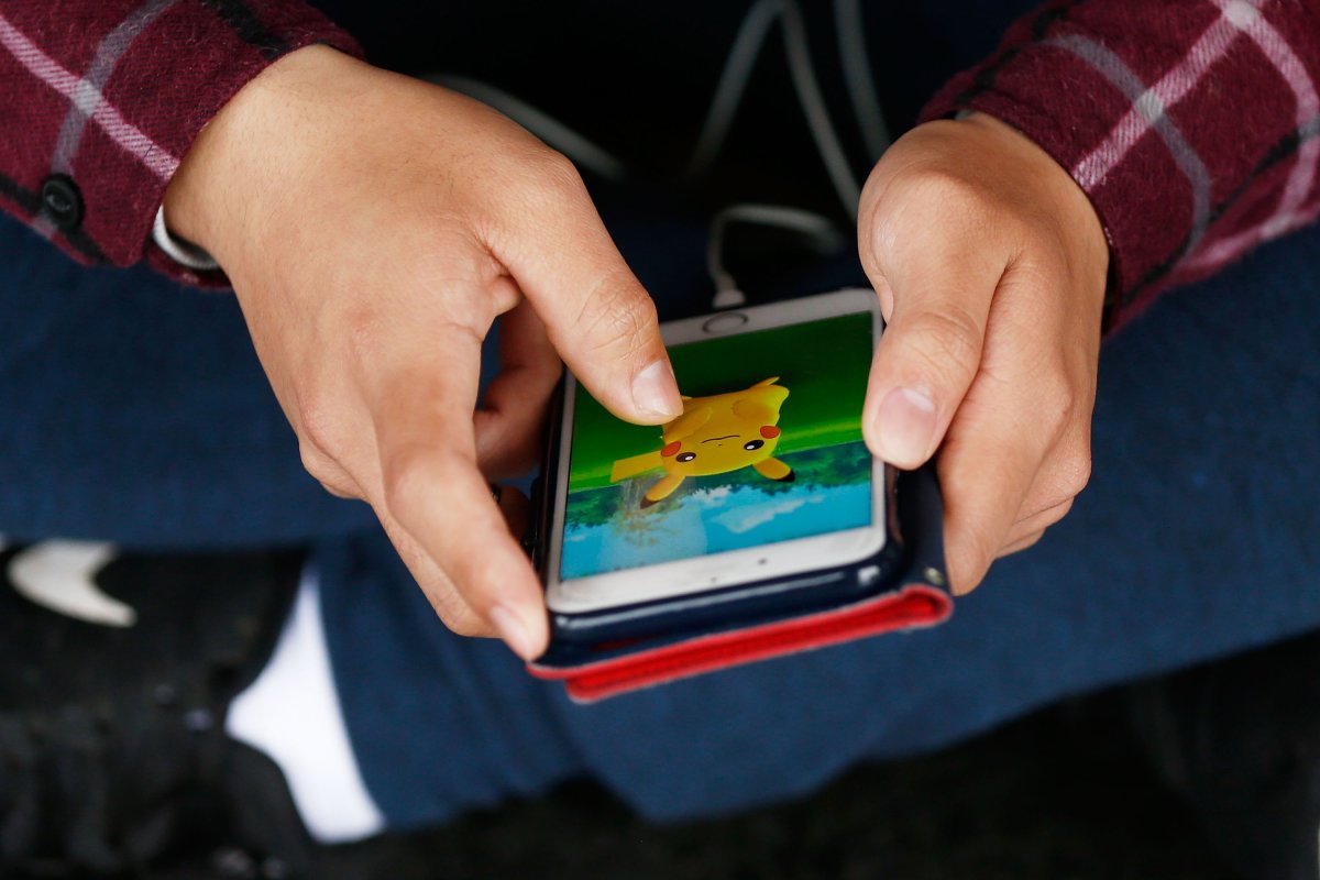 Mobile user and Pikachu on Pokemon app