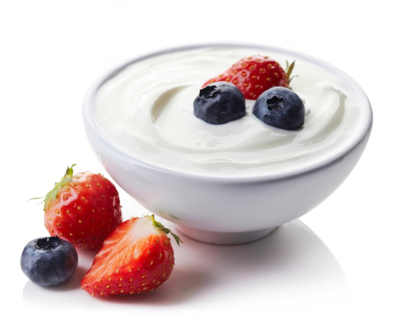 Berries in a bowl of Greek yogurt.