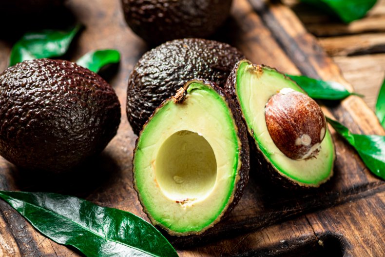 Avocado halves on a table.