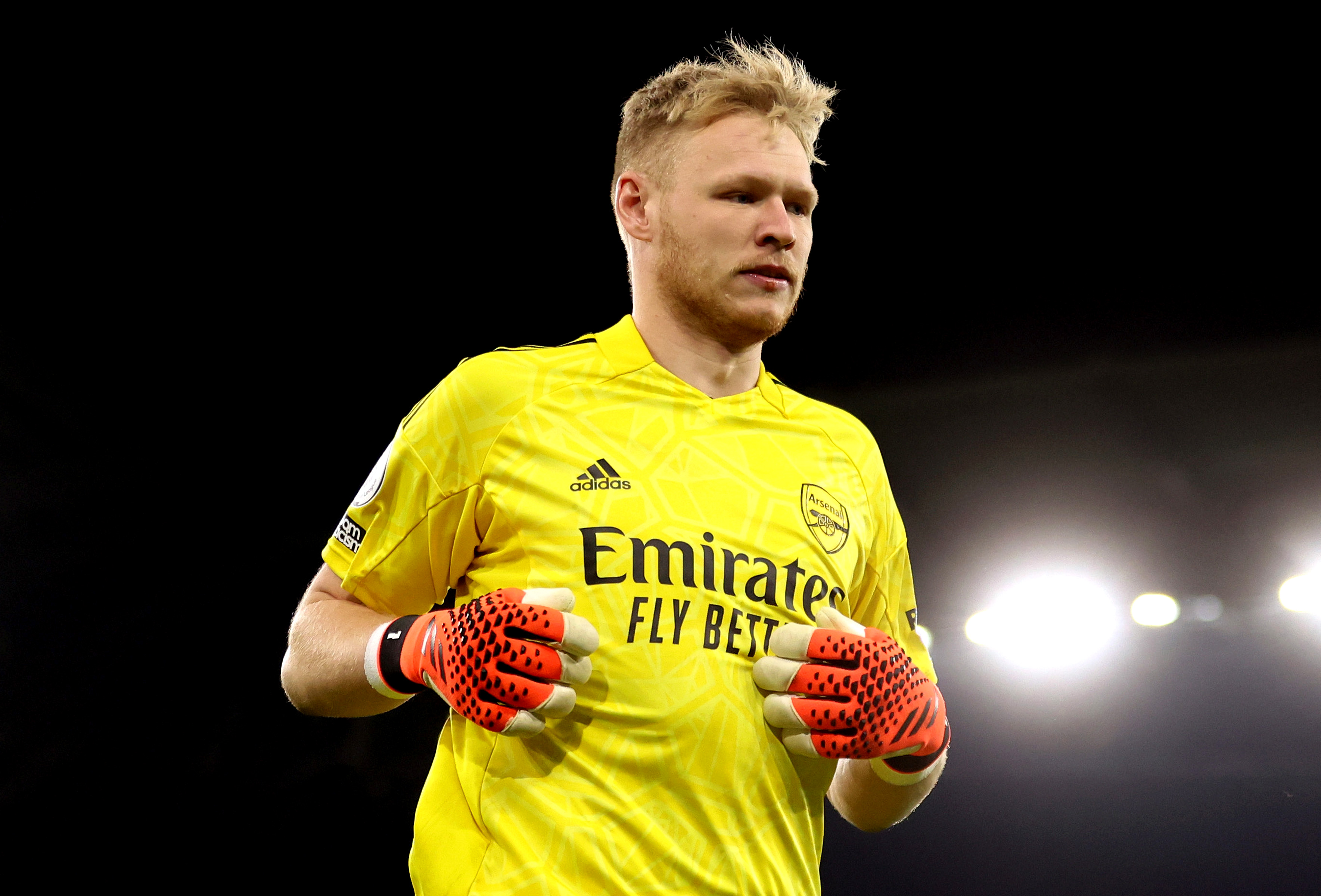 Arsenal goalkeeper Aaron Ramsdale appears to be kicked by