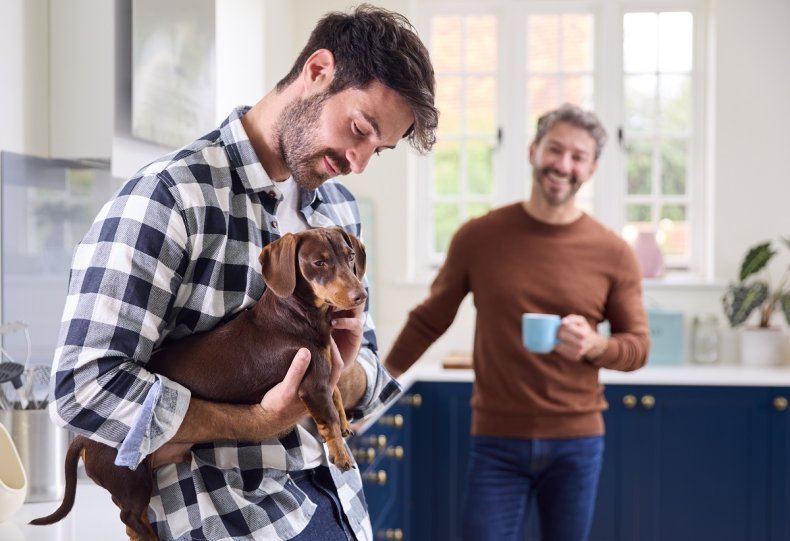 Man holding dachshund