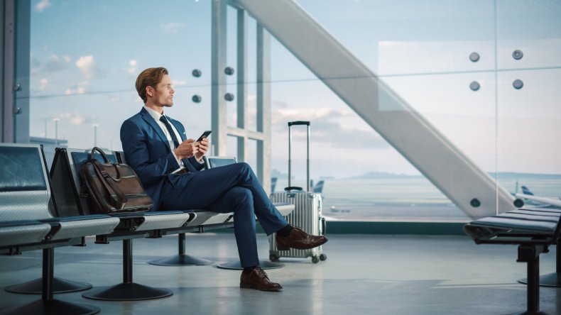 Man sitting at airport.