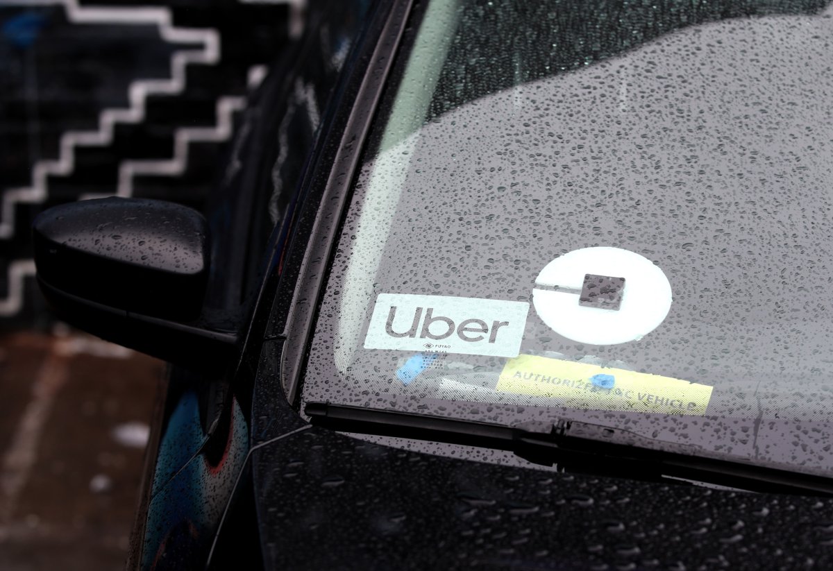 The Uber logo is displayed on car