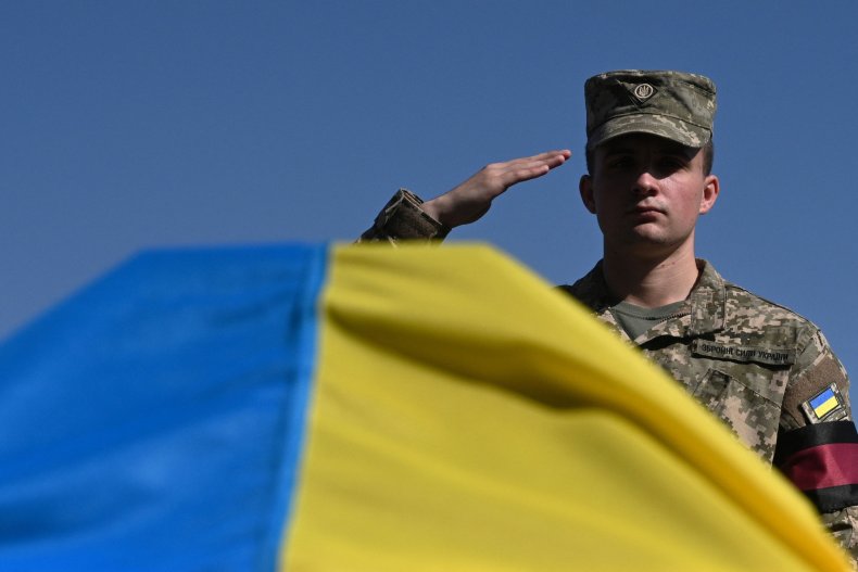 Ukrainian soldier salutes comrade's coffin in Lviv