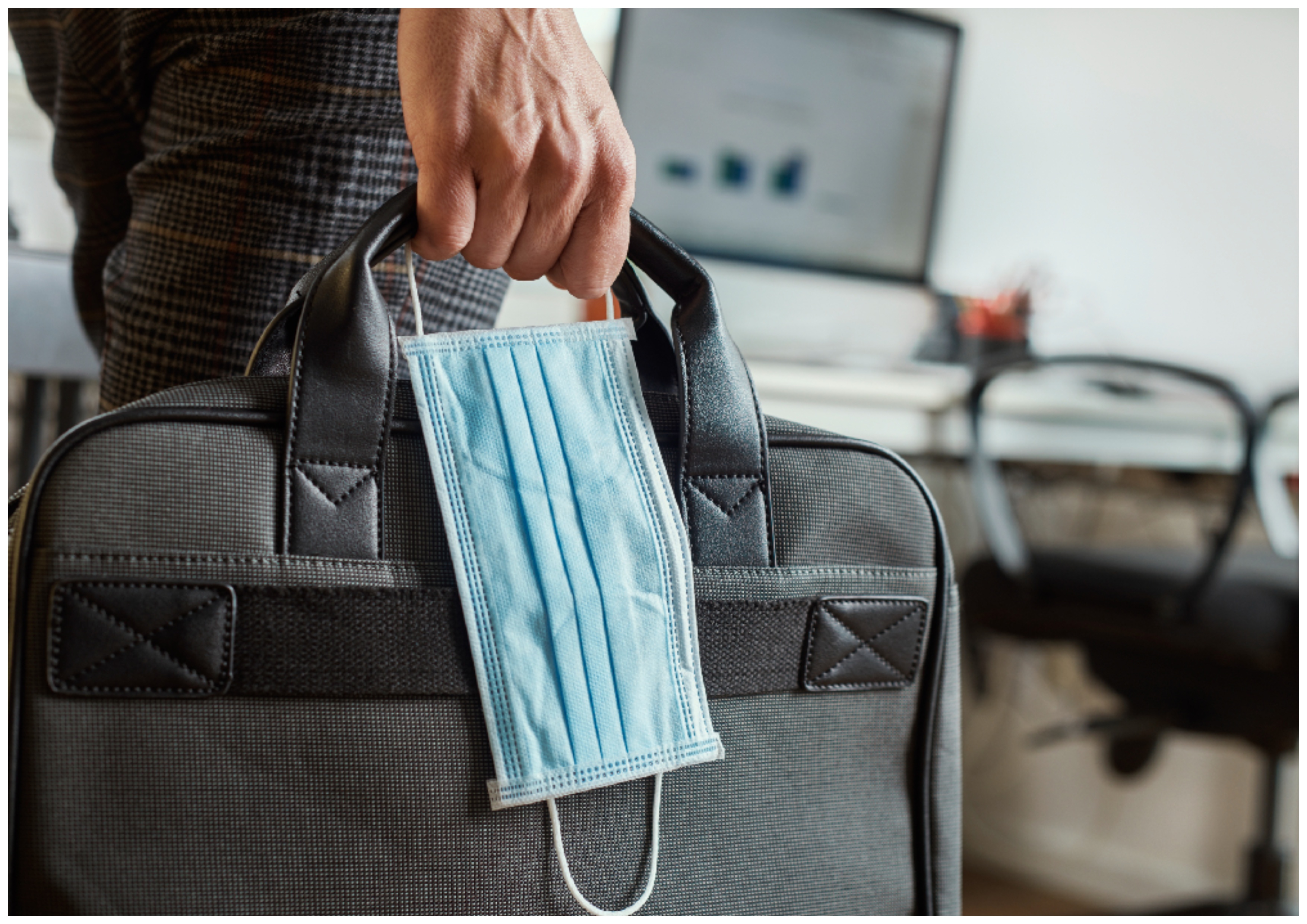 Return to work. The man carrying the Briefcase. Return to work photo. Return to Office. Covid stock photo Business.