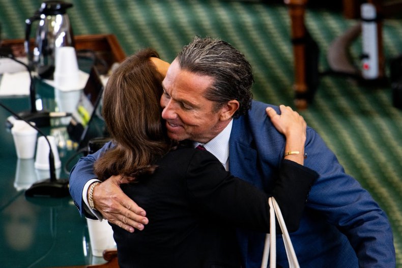 Angela Paxton hugs attorney Tony Buzbee