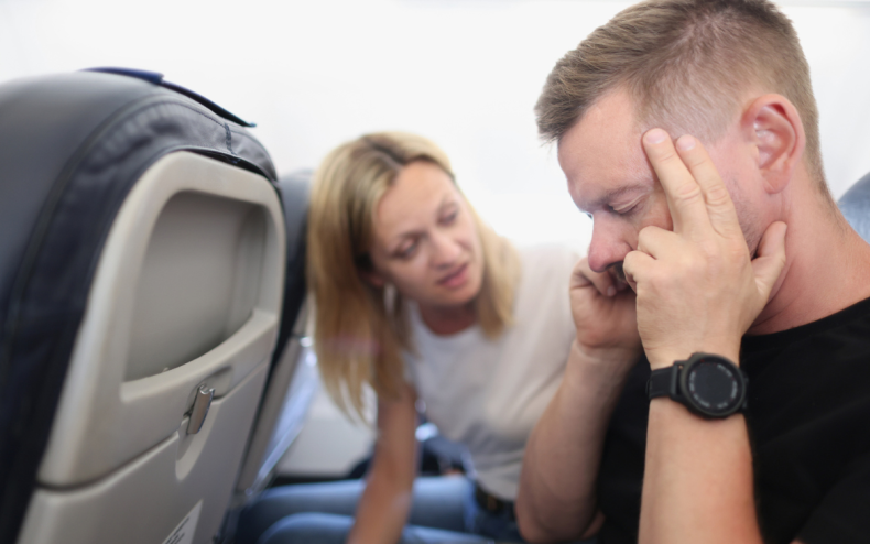 Man and woman on a plane.