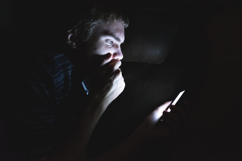 Teenager looks for cell phone in the dark