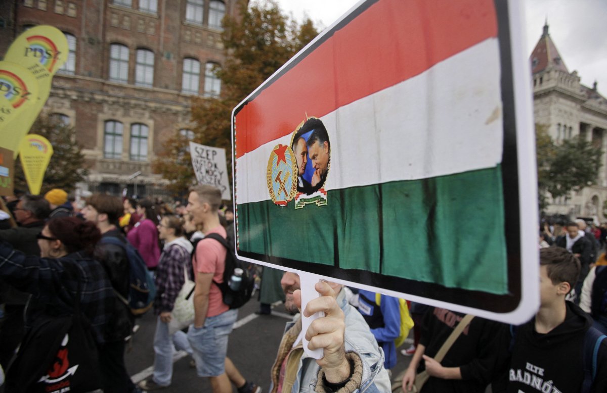 Hungarian protester holding Putin-Orban banner