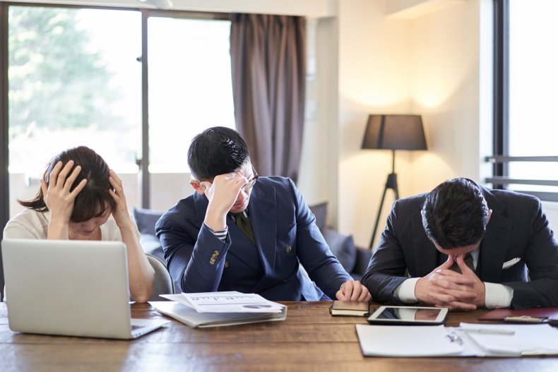 Frustrated coworkers in a meeting