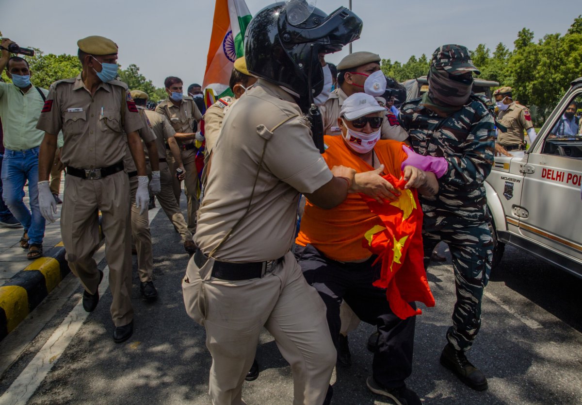 Tibetan activist being taken away 
