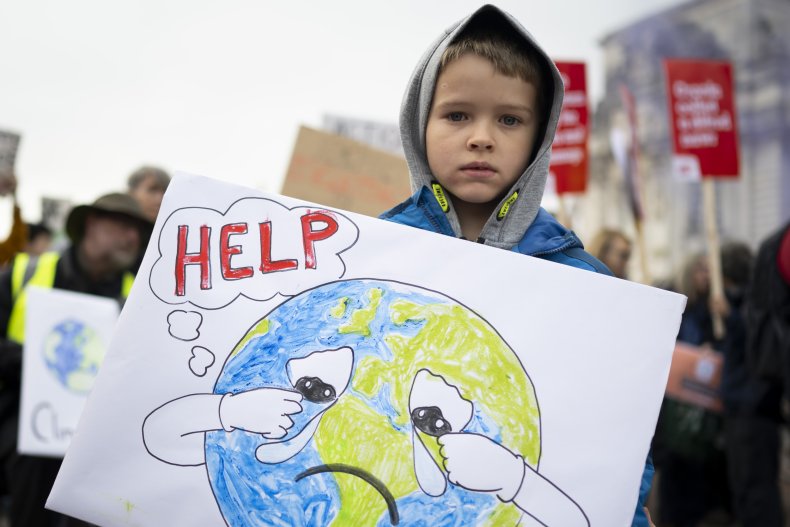 Boy with climate protest sign