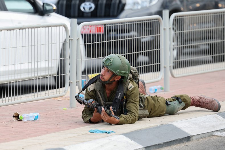 Israel soldier takes cover in Sderot