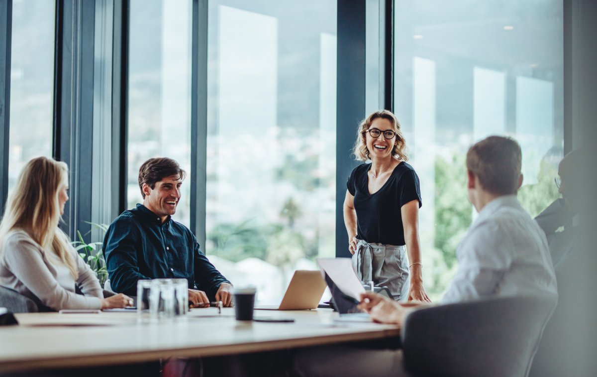 Employees having casual discussion in conference room