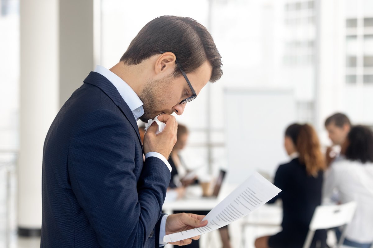 nervous man reading paper