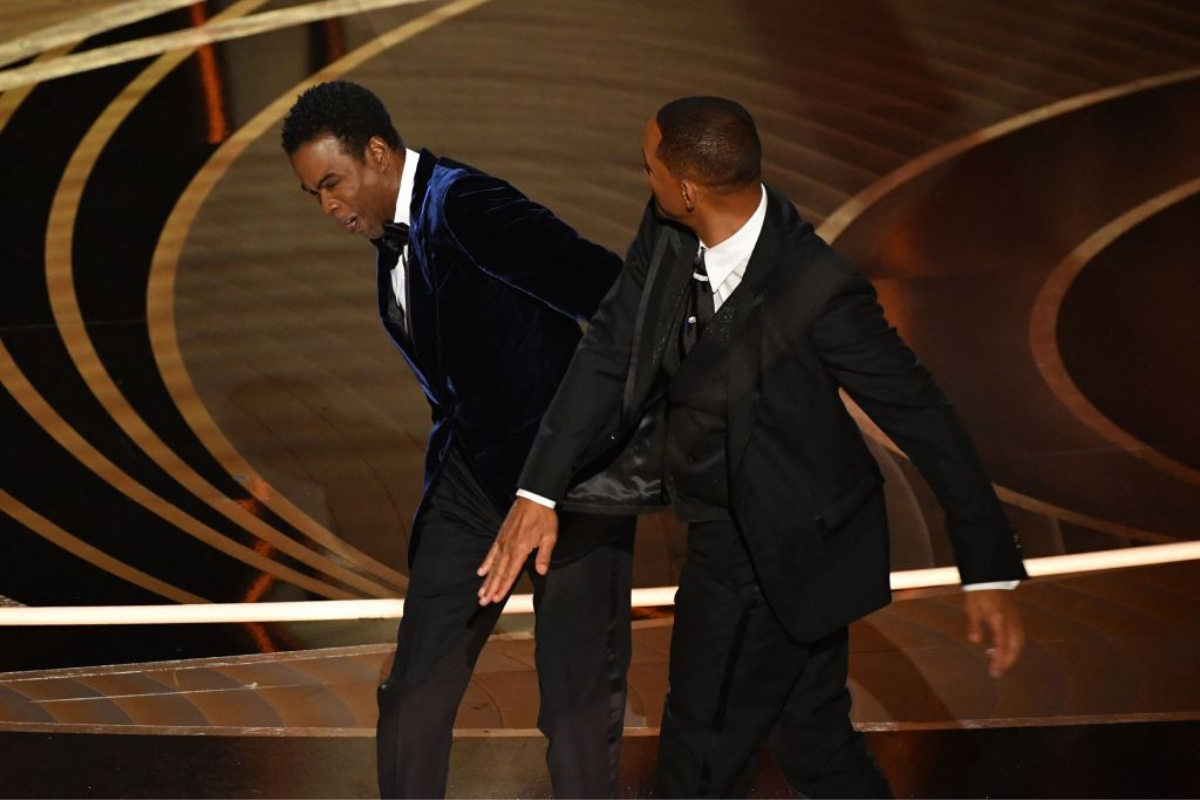 Will Smith (right) slaps Chris Rock
