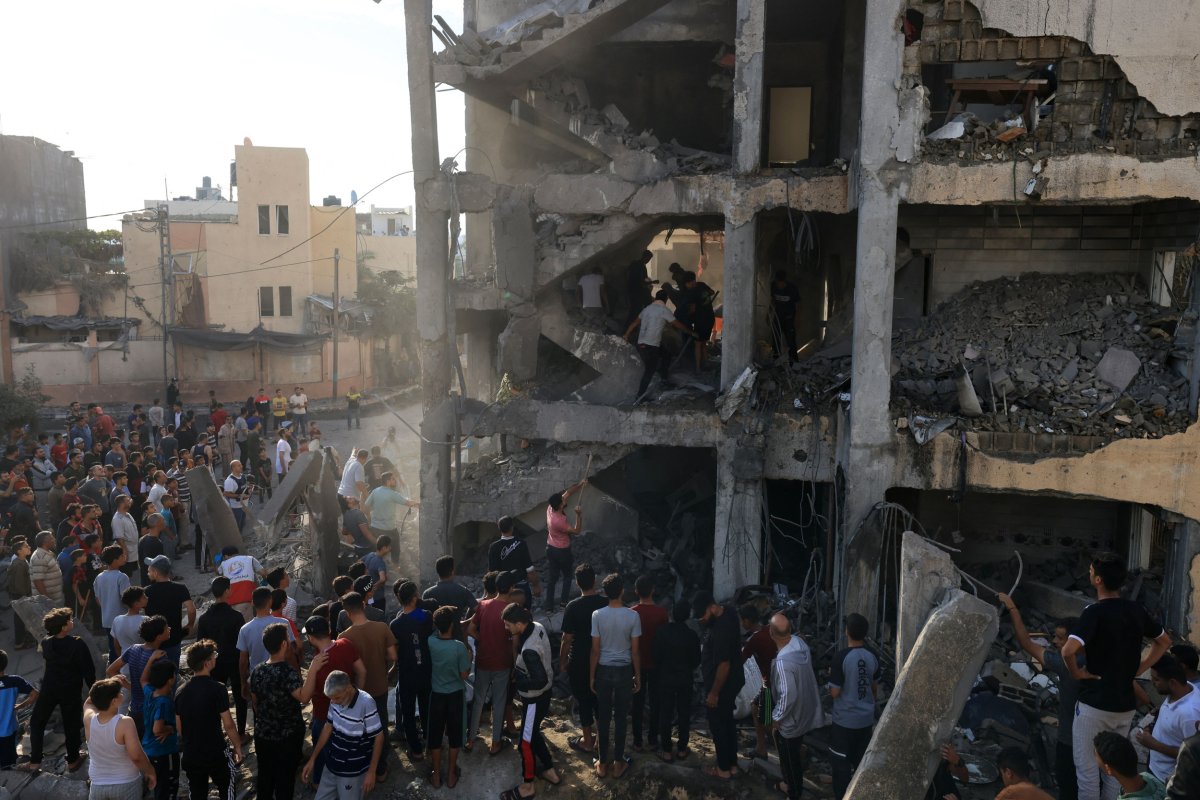 Palestinians search through the rubble 