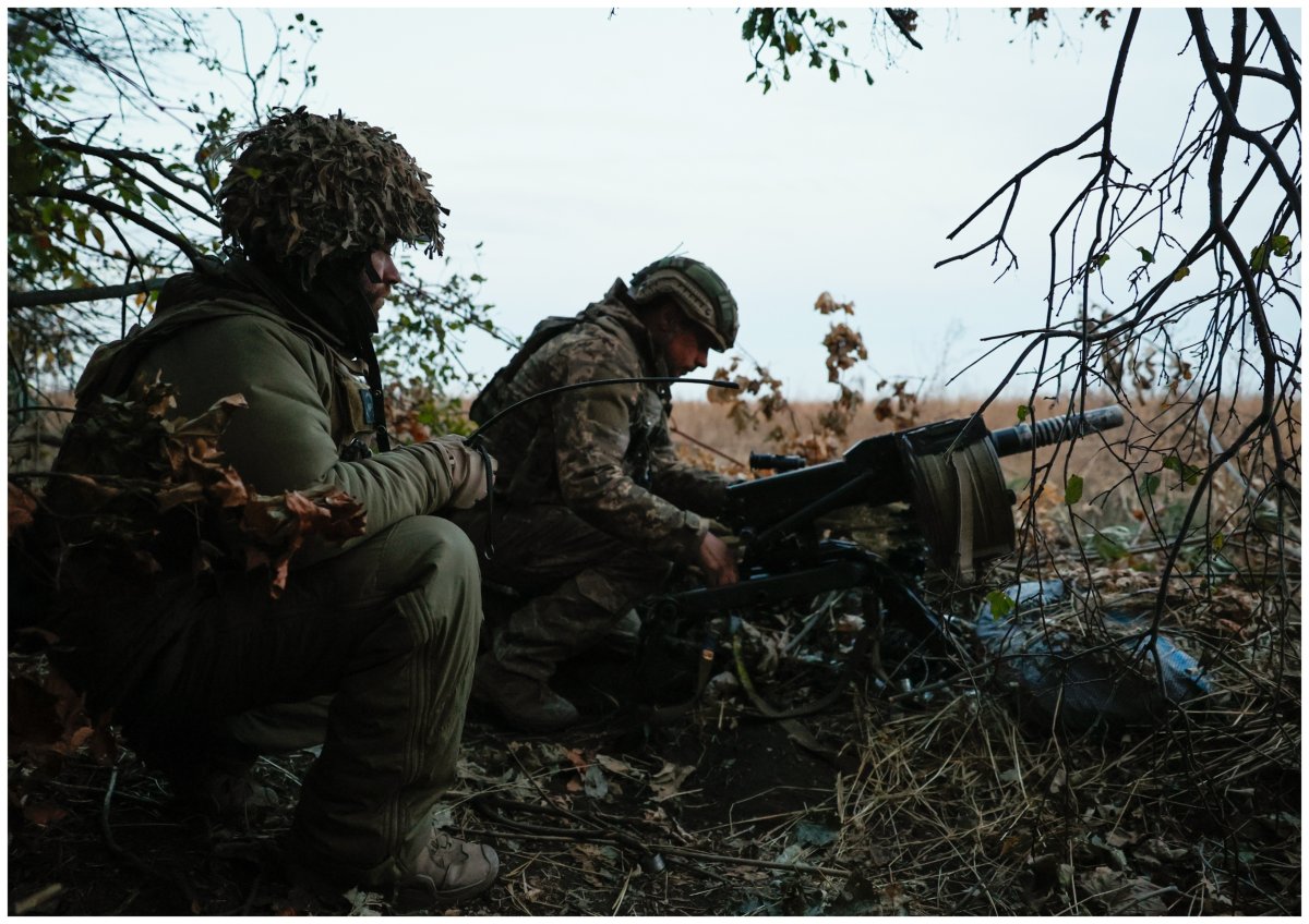 Ukrainian soldiers fire on a Russian position