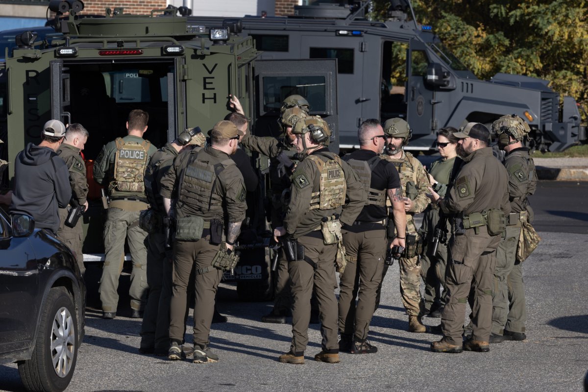 Law enforcement agents search for Robert Card