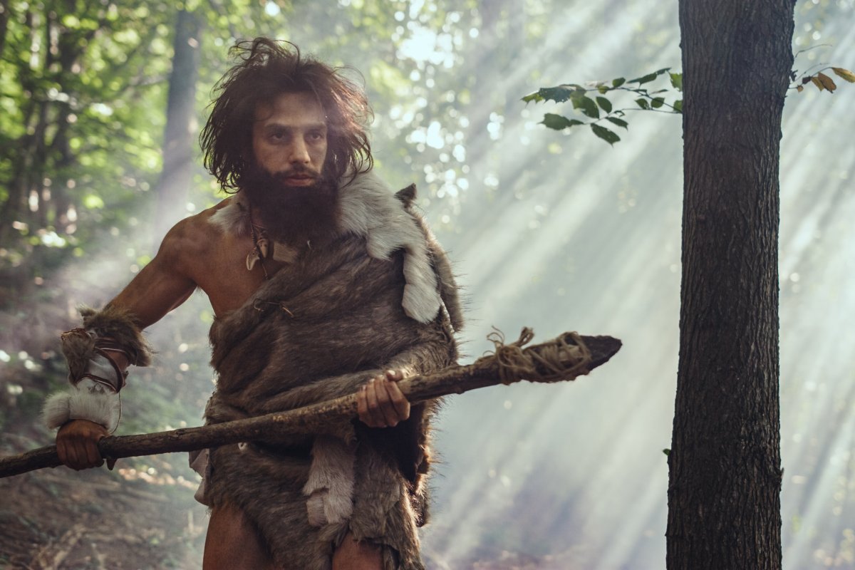 A prehistoric human with a spear