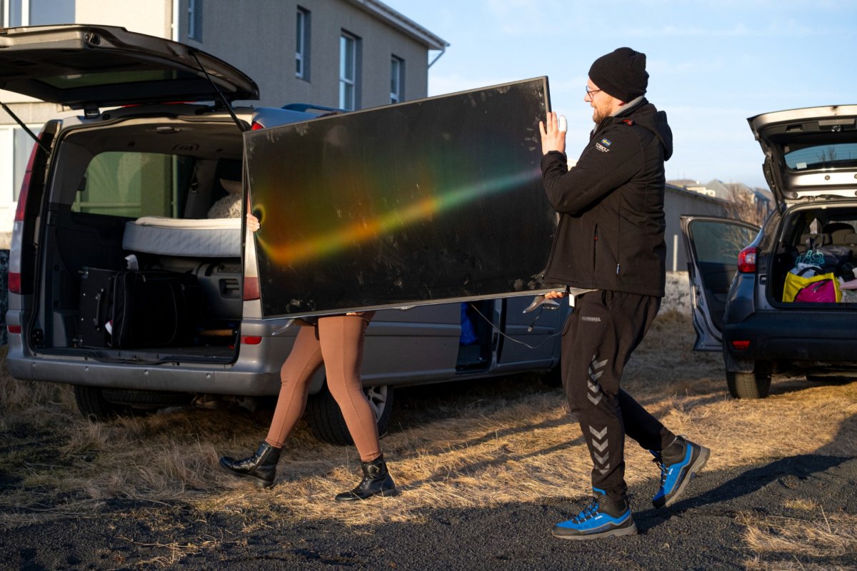 inhabitants carrying belongings