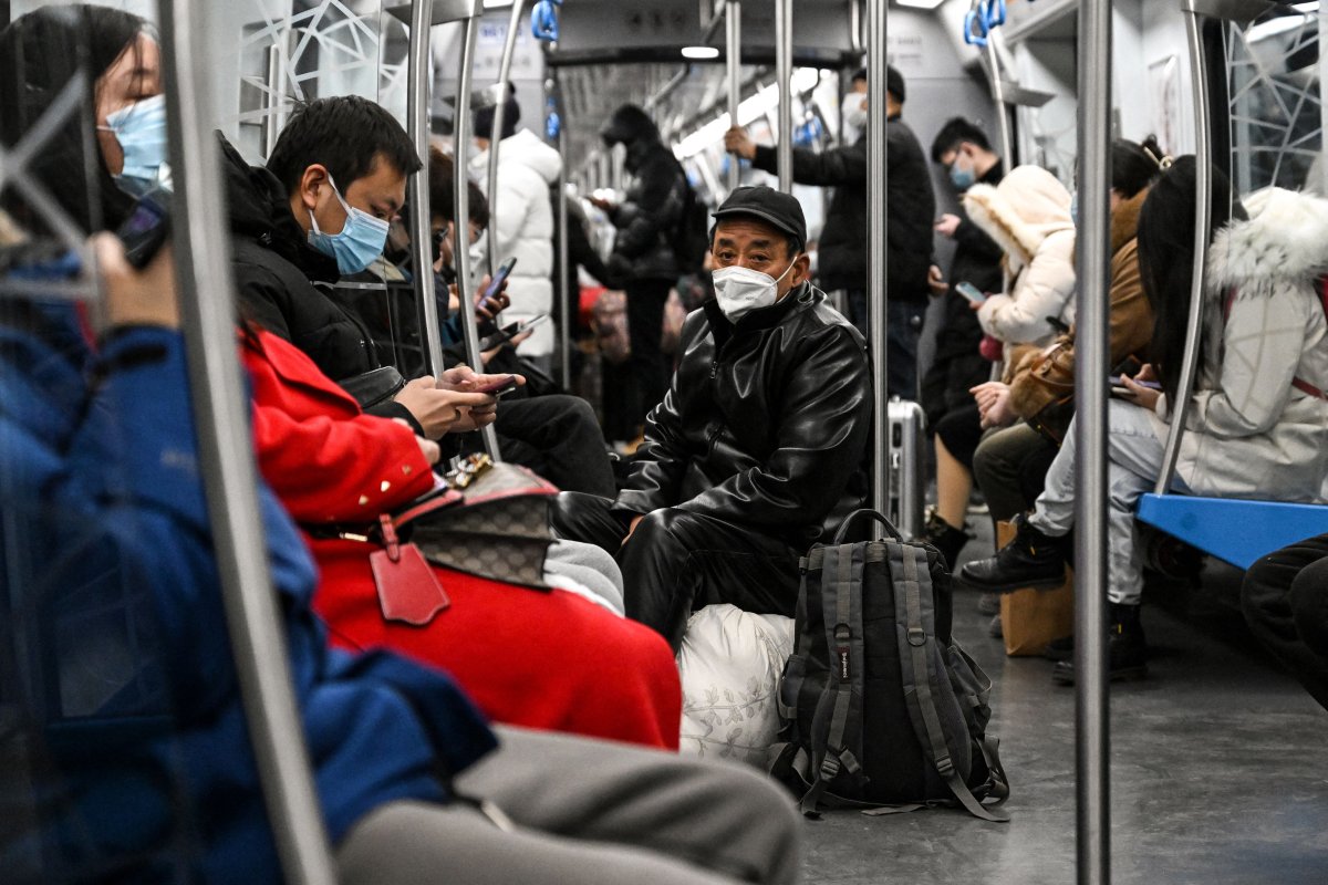 People Wear Masks on Train in Beijing