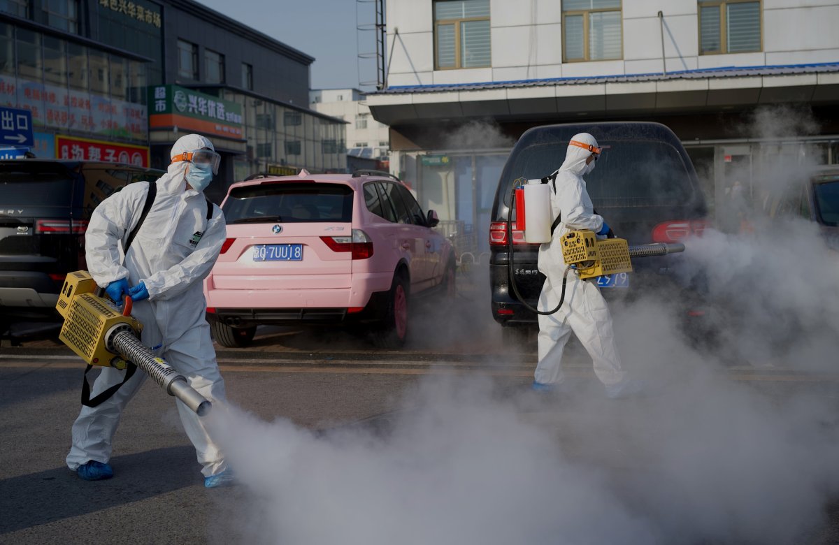 Anti-COVID Workers Disinfect a Beijing Market