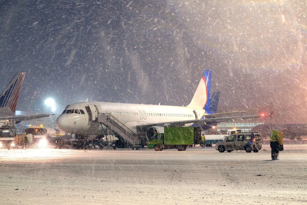 airplane parked snow airport