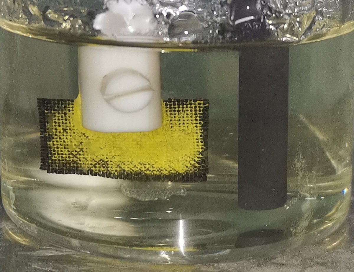 Uranium precipitate forms on a cloth electrode