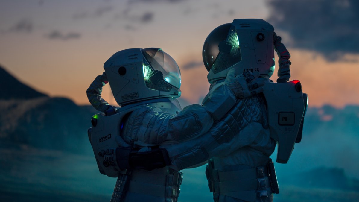 astronauts embracing