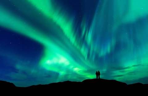 Couple watching northern lights. 