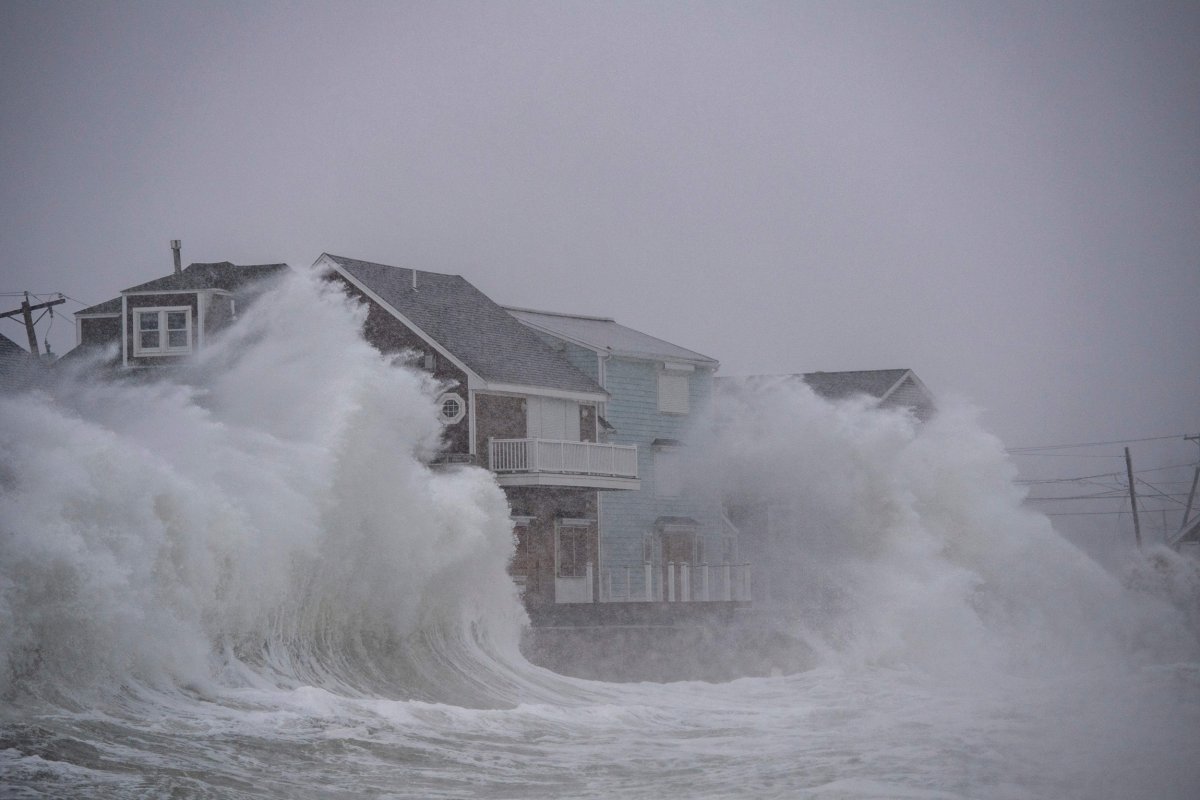 Hurricane waves hit ocean-front houses in Massachusetts