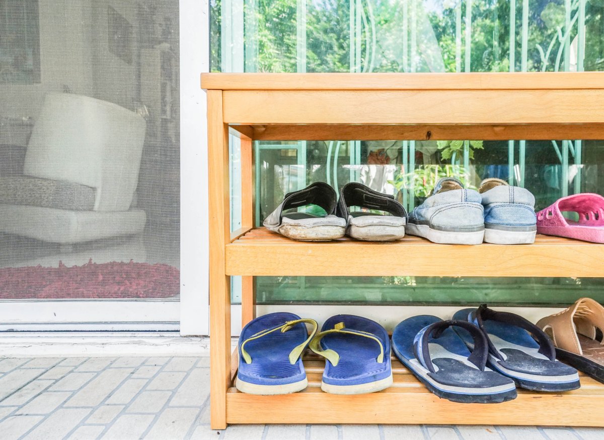 Shoes on a rack outdoors.