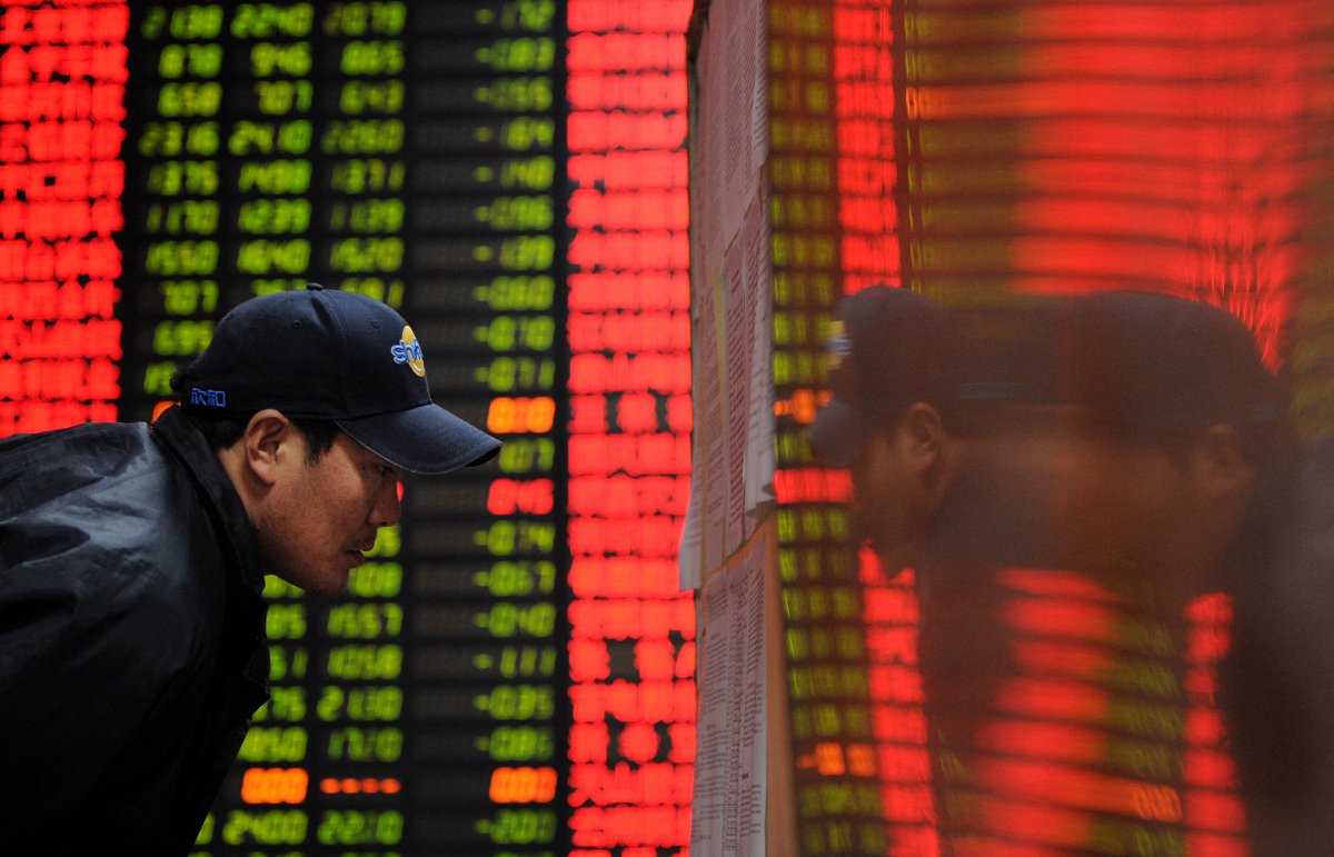 Investor Checks Stock Prices in Shanghai