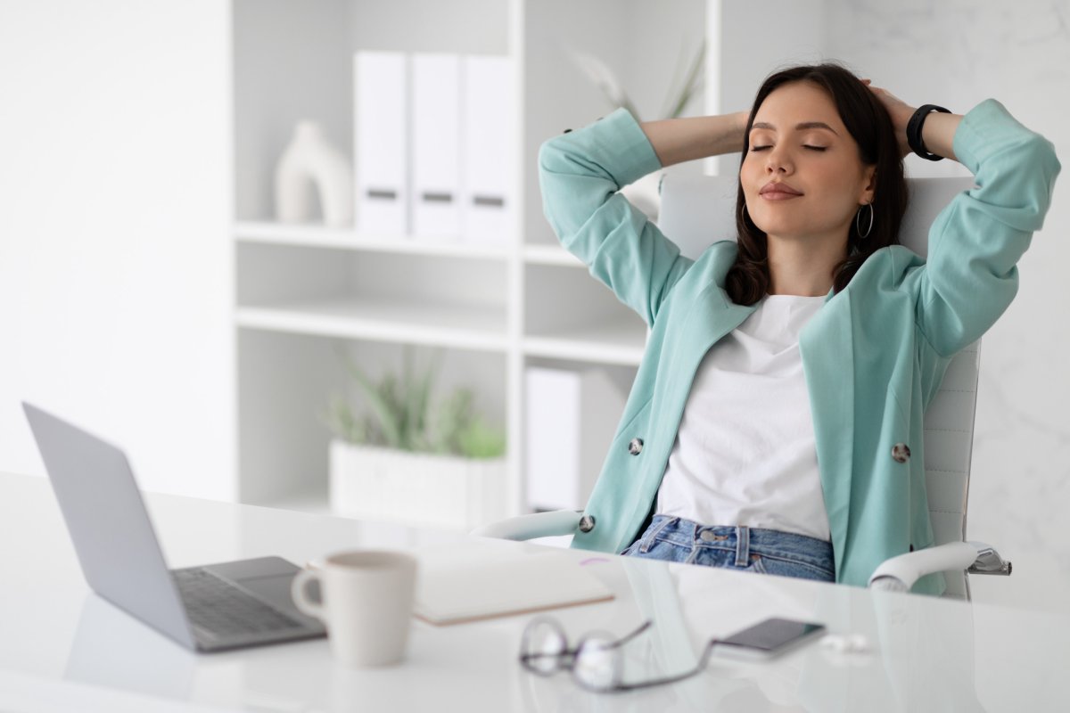 Woman relaxing at the desk.