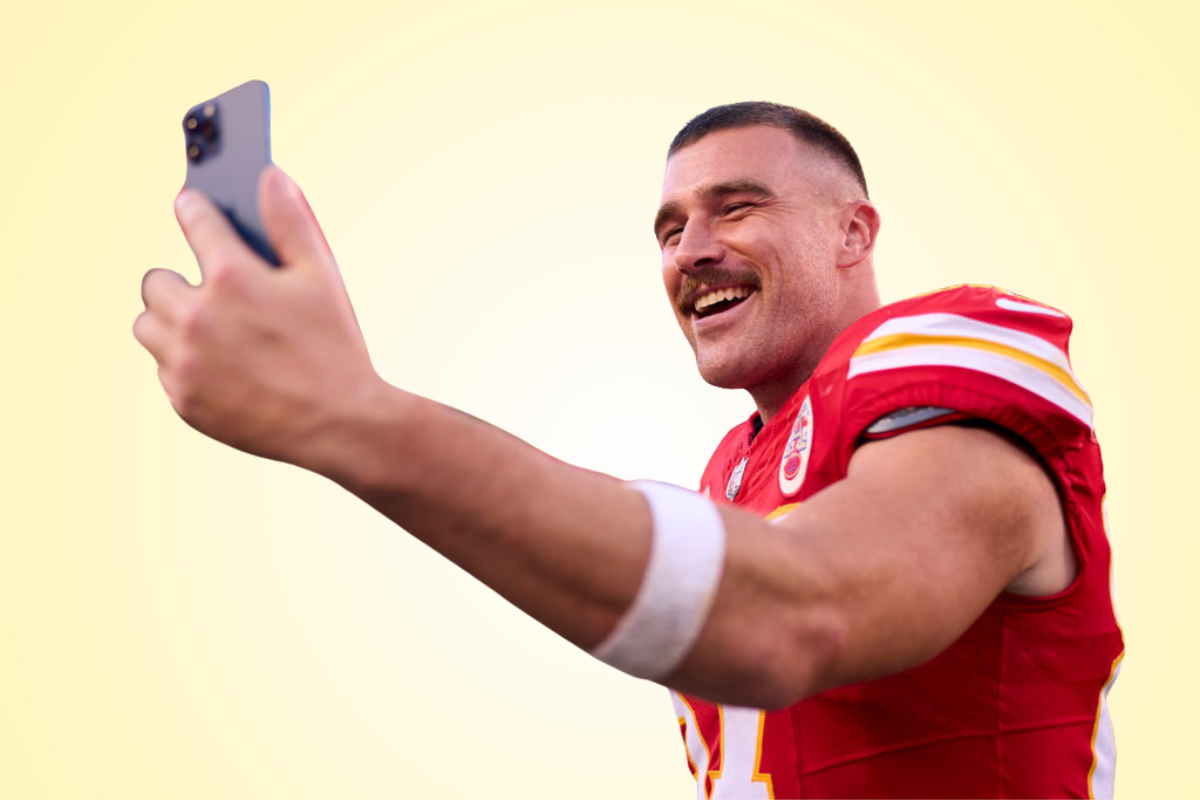 Travis Kelce taking a post-game selfie, 2023