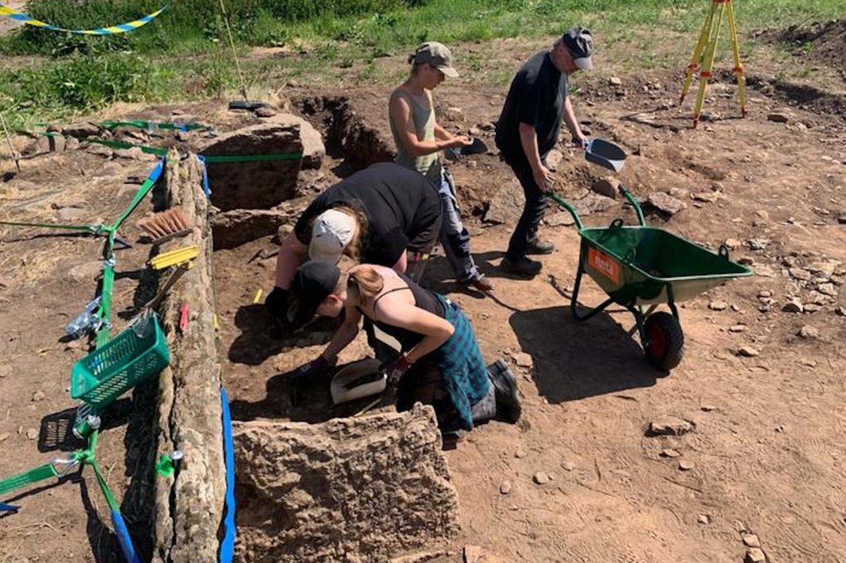 Archaeologists excavating a megalithic tomb in Sweden