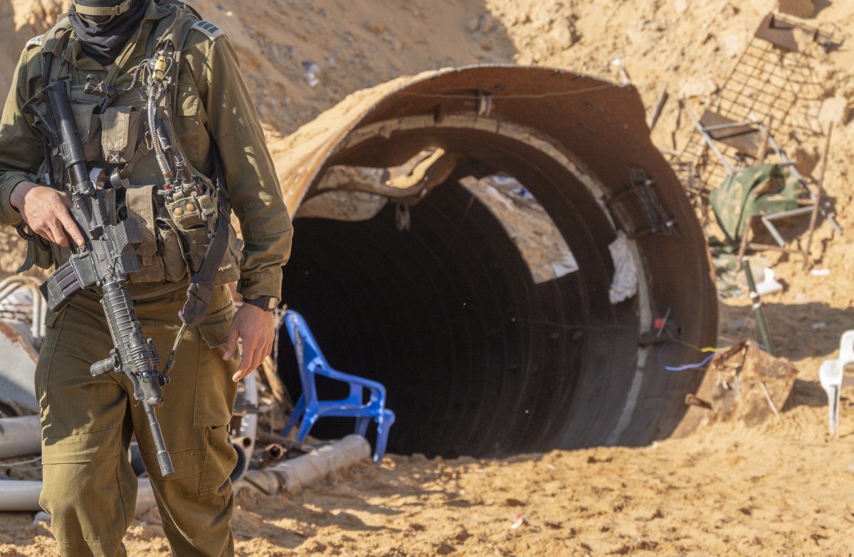 Israeli soldier next to Palestinian militant tunnel