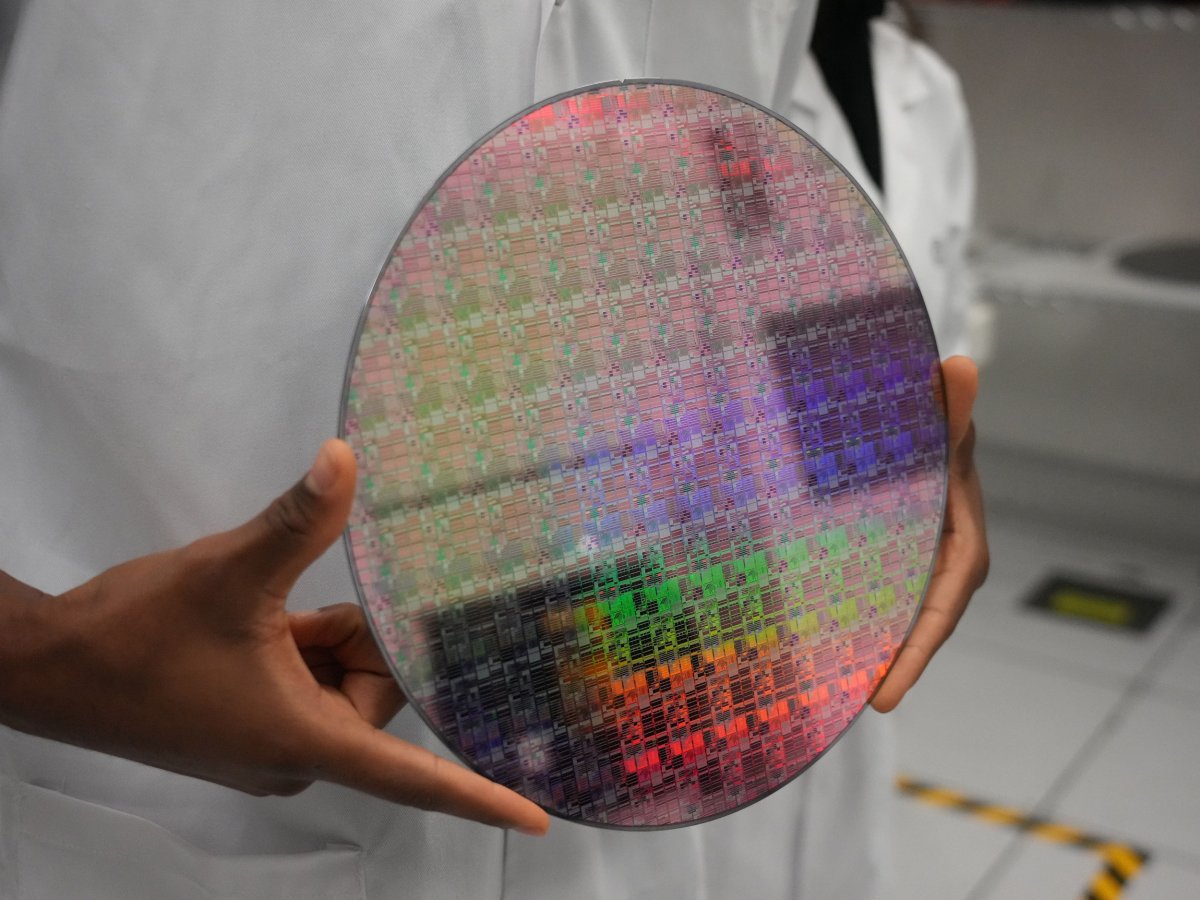 Person Holds Silicon Wafer 