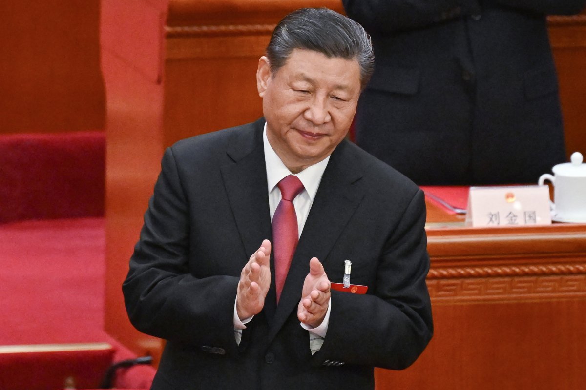 China's President Xi Jinping applauds