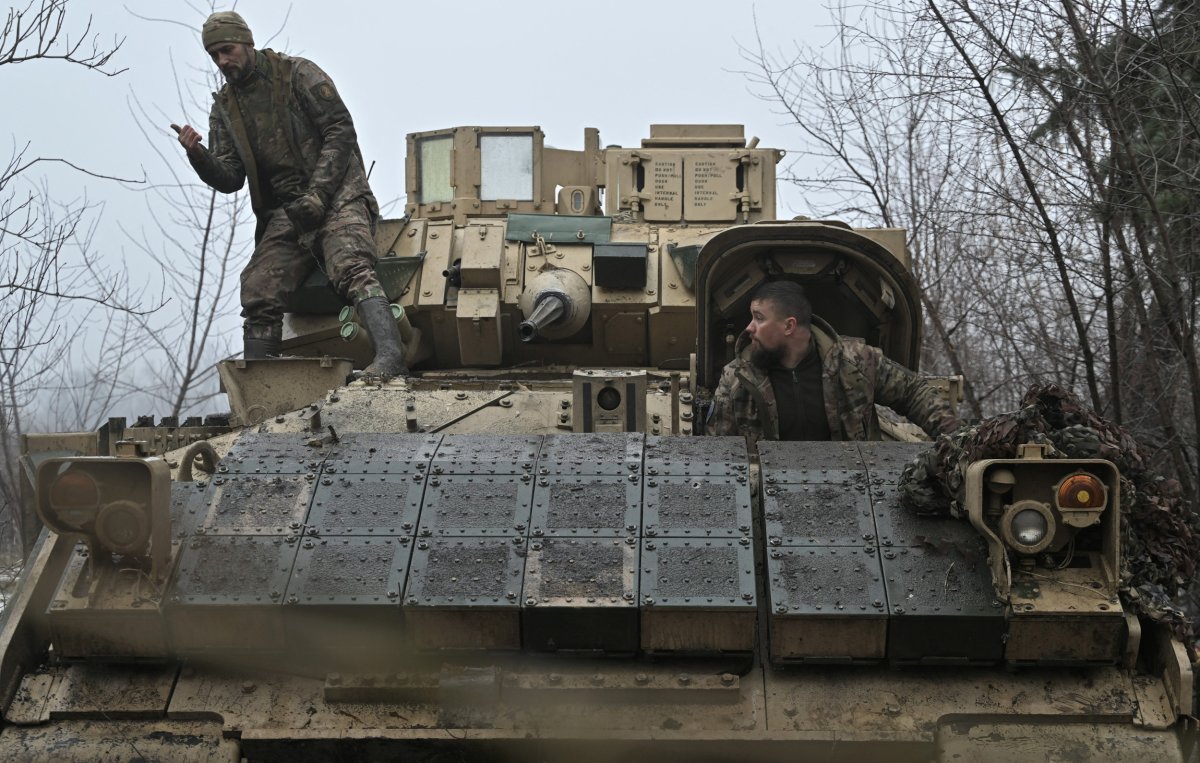 Ukrainian troops with a Bradley