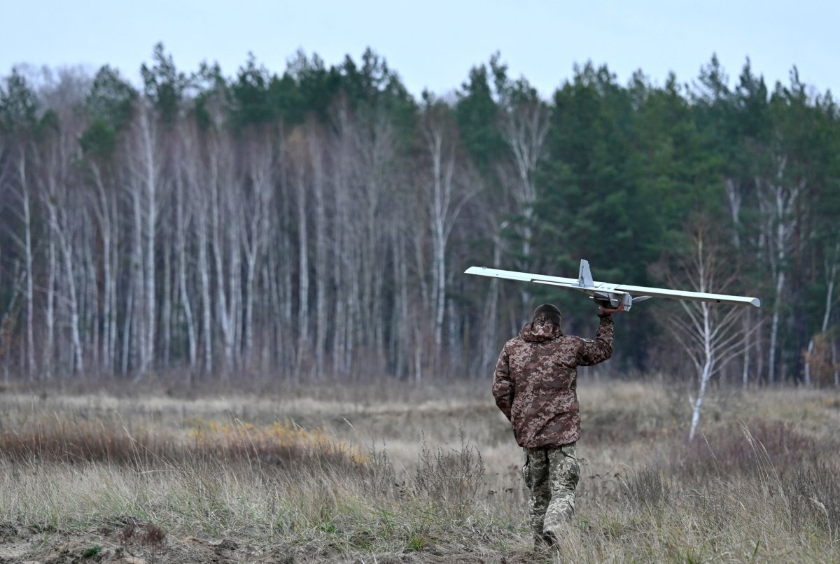 Ukrainian soldier carrying drone November 2023