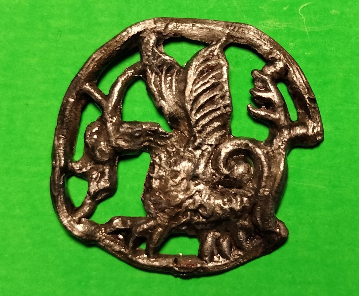 A metal artifact with a basilisk