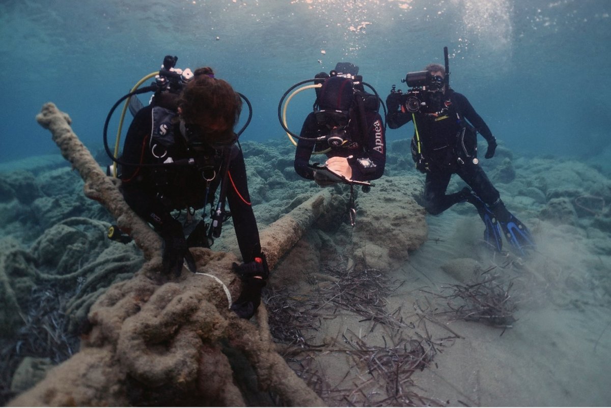 Marine archaeologists documenting an anchor