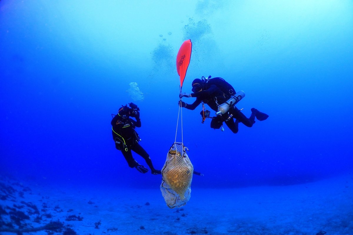 Marine archaeologists retrieving a vessel