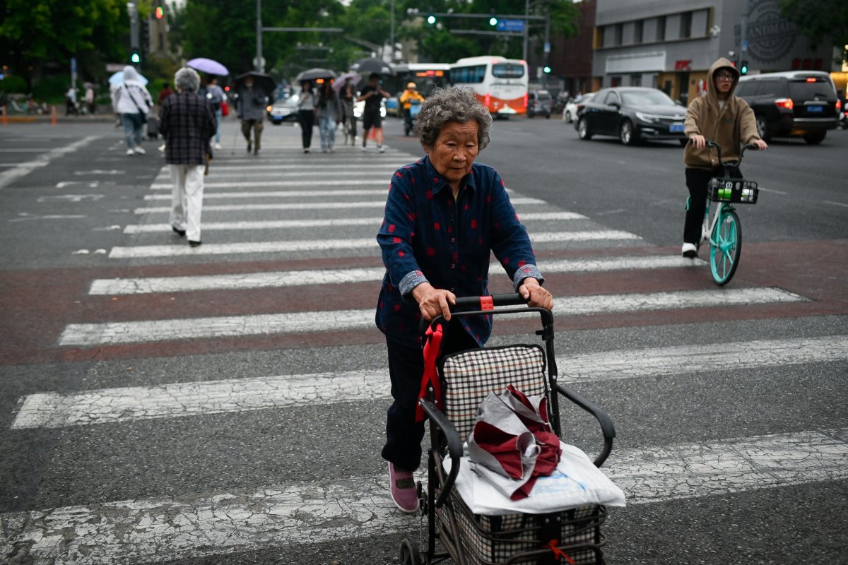 Elderly Woman Crosses Street in Beijing