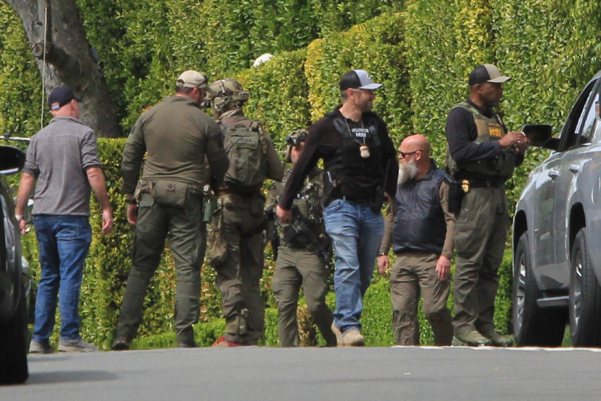 Armed federal agents outside Combs' LA home