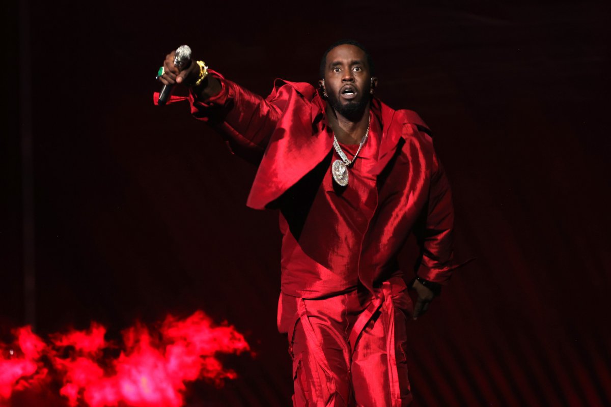 diddy performing wearing red