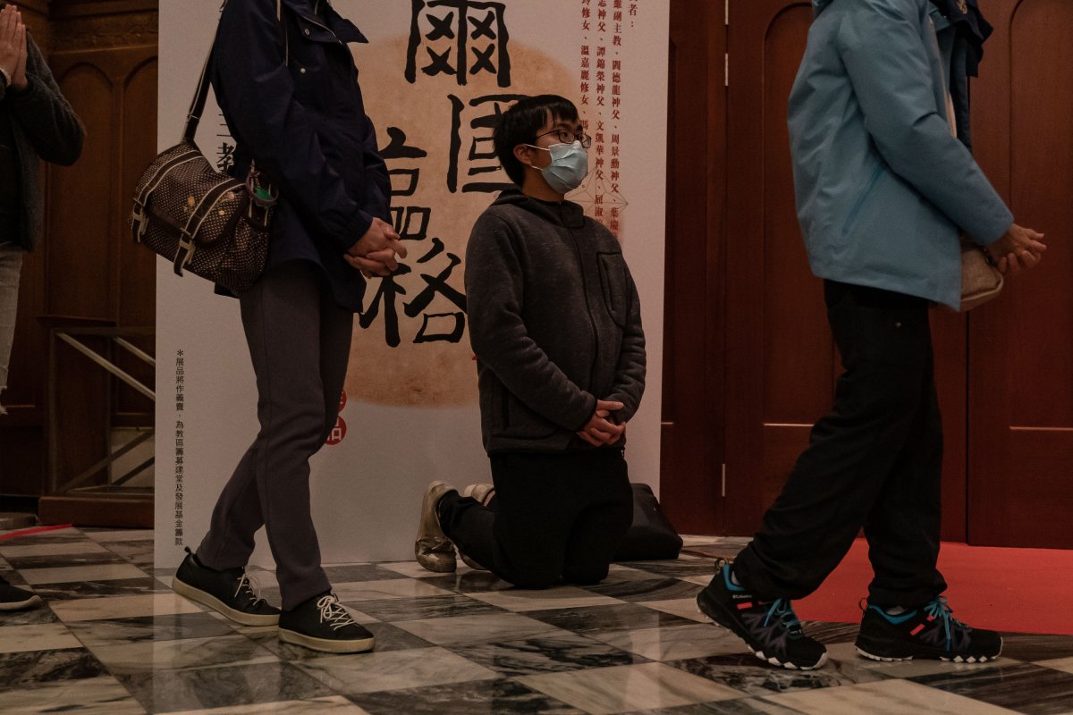 Man praying Hong Kong cathedral